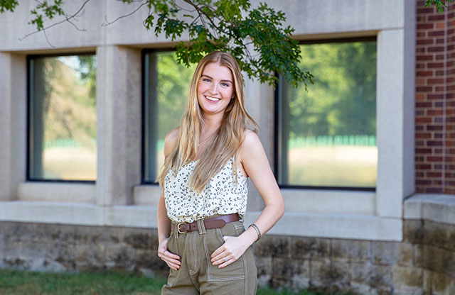 Angie Norton standing outside under tree